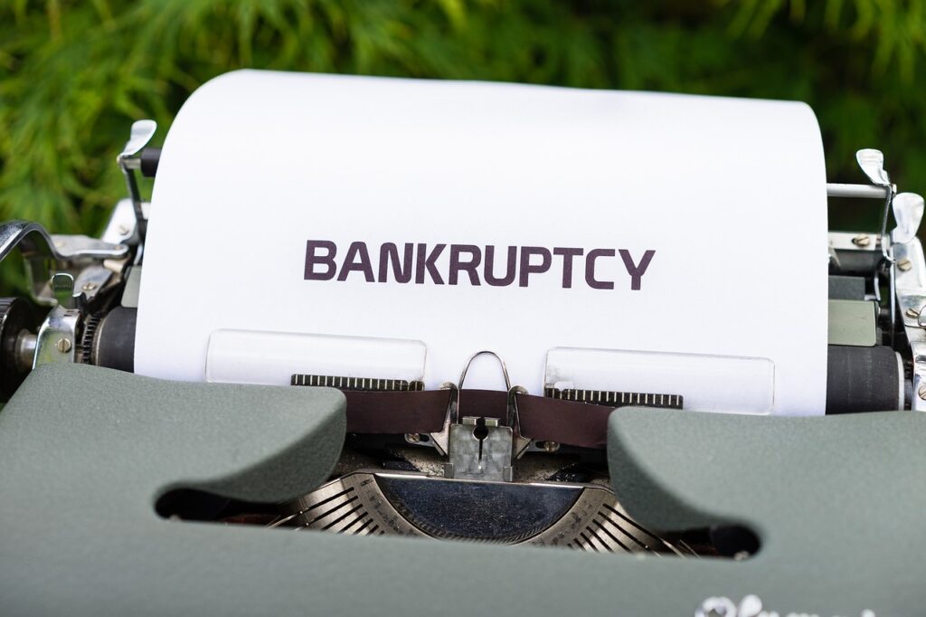 typewriter, bankruptcy, money